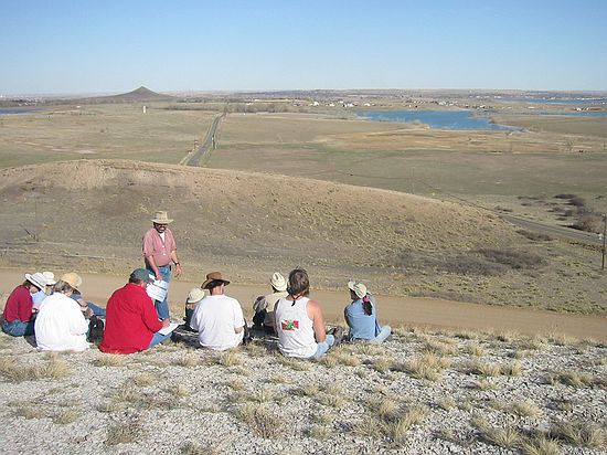 Summarizing the geological concepts seen during the day.  Sitting on the Niobrara formation, Smoky Hills member and looking out over the vast expance of the Pierre Shale.  Haystack Butte off in the distance at left.